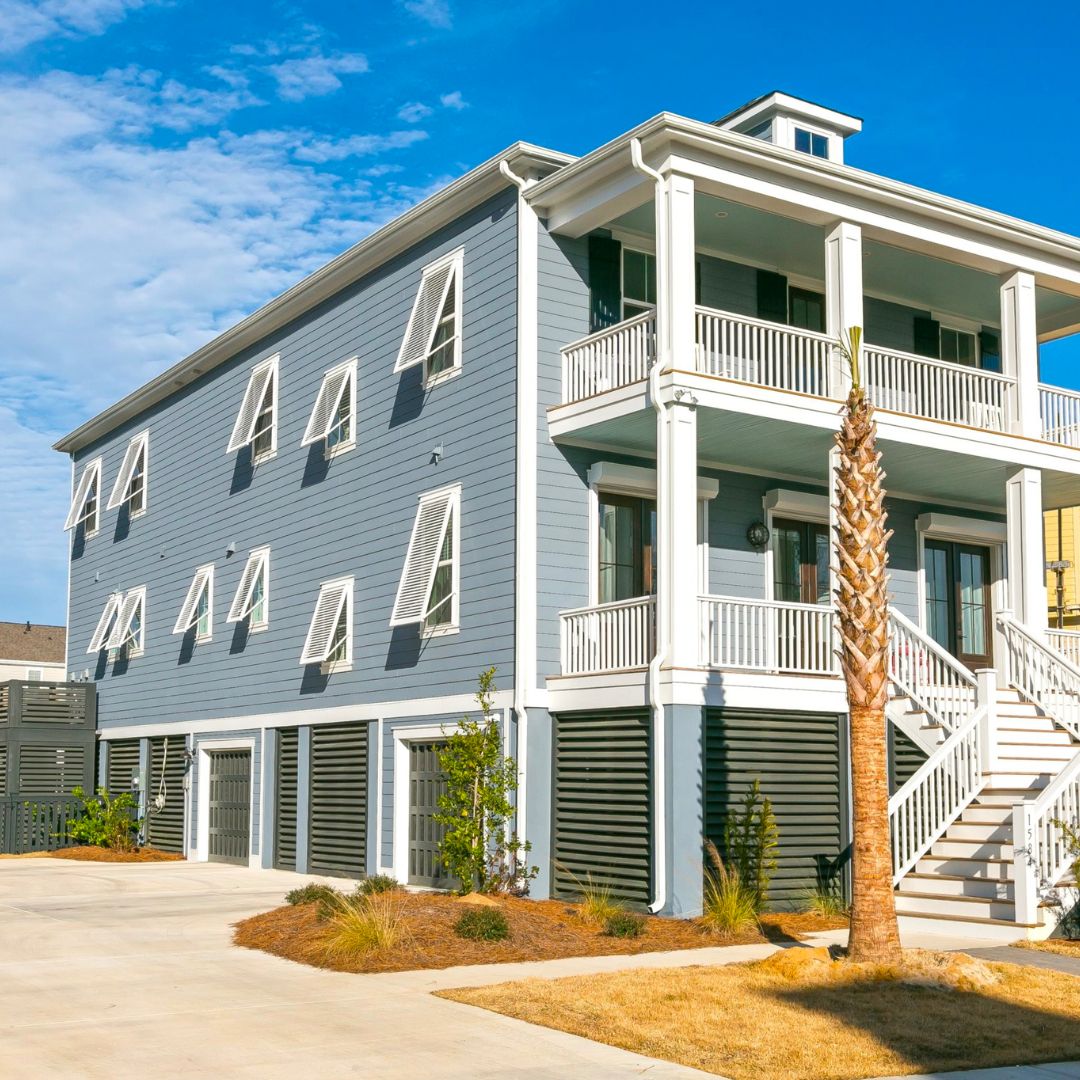 White Bahama Shutters on a blue house 