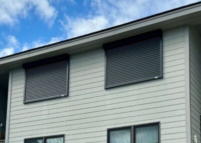 Hurricane Shutters over two windows in Wrightsville Beach