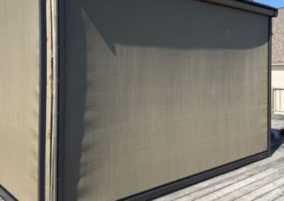 Covered porch with hurricane screens on the water